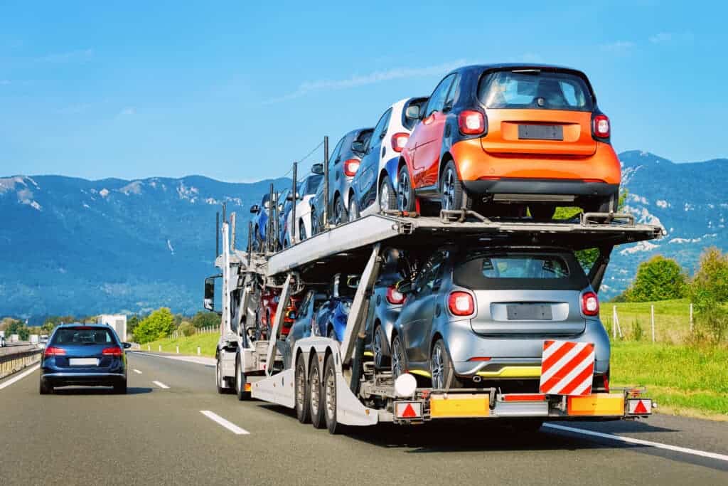 a car carrier with cars on it
